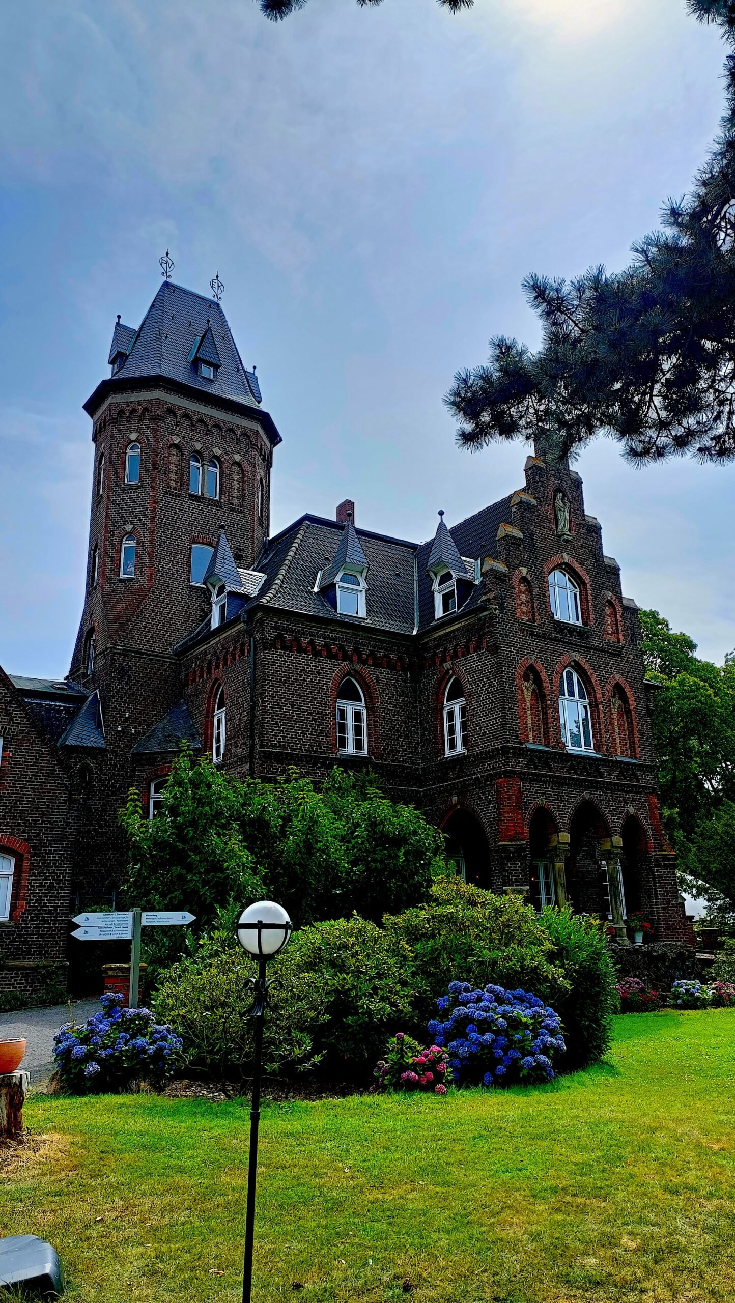 a large brick building with a clock tower